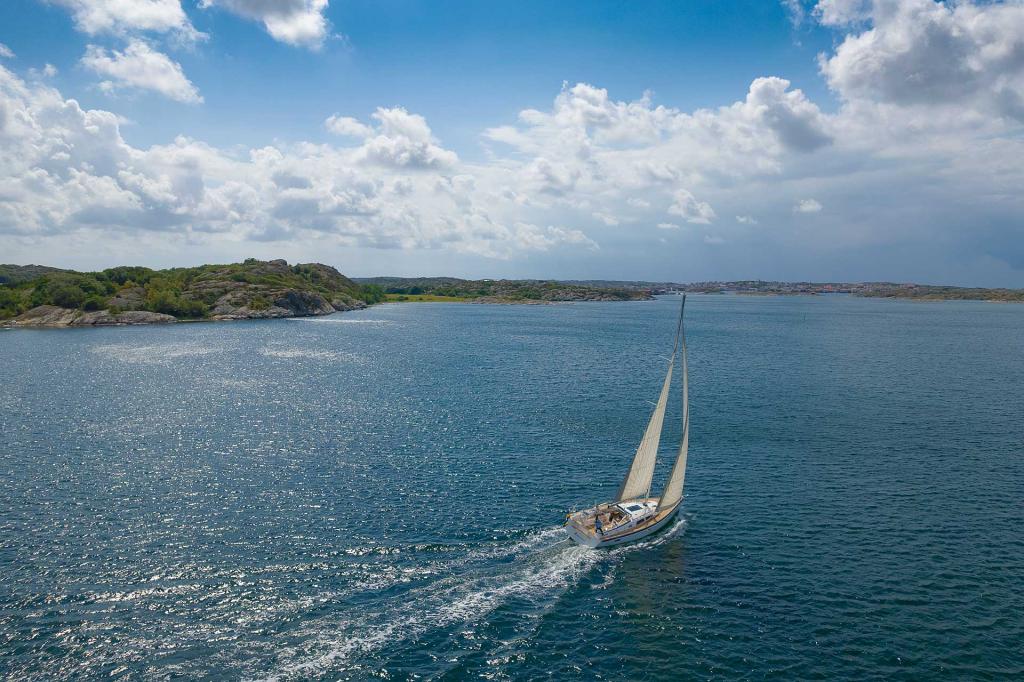 hallberg-rassy-400-drone-sailing-coastline.jpg