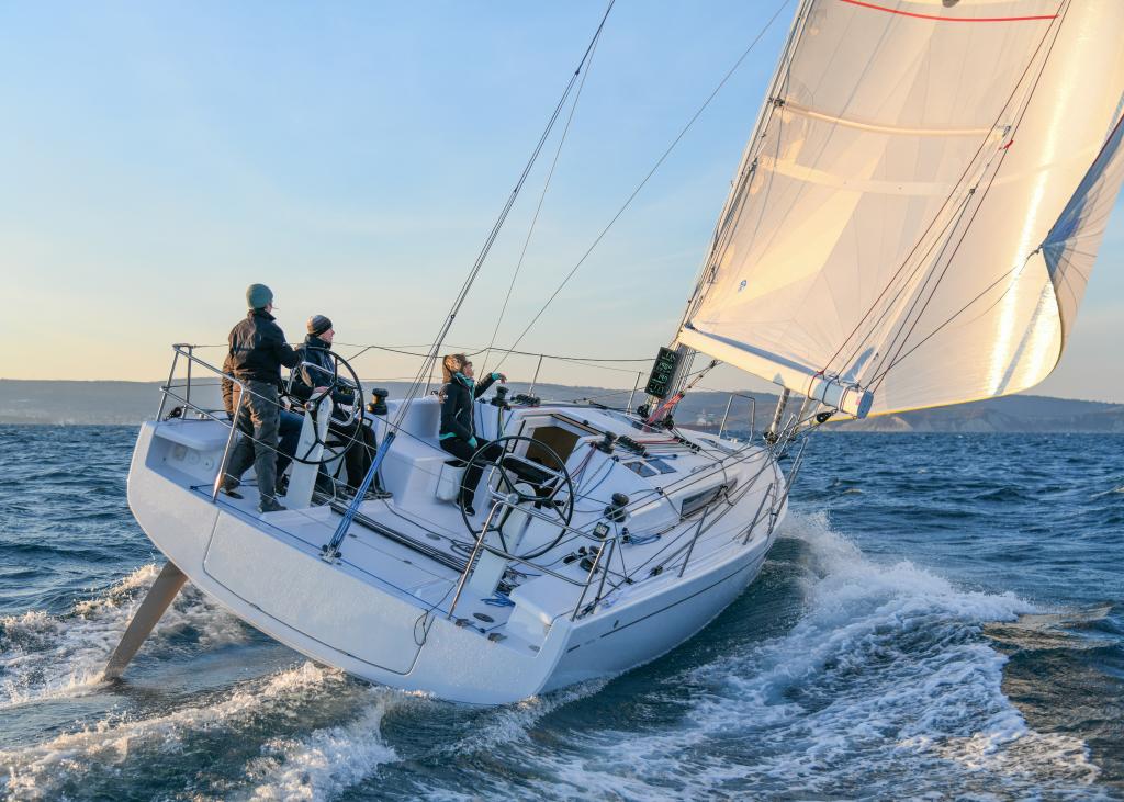 beneteau-first-36-crew-trimming-sails-golden-hour.jpg