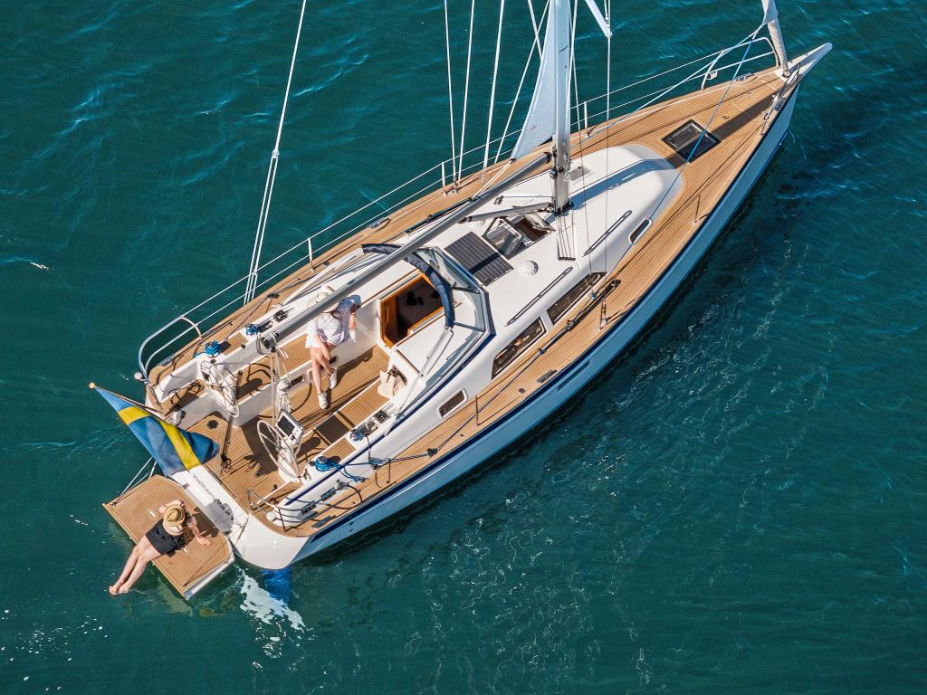 hallberg-rassy-340-deck-aerial-summer-clear-water.jpg