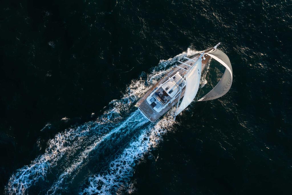 hallberg-rassy-69-drone-aerial-sailing-dark-water.jpg