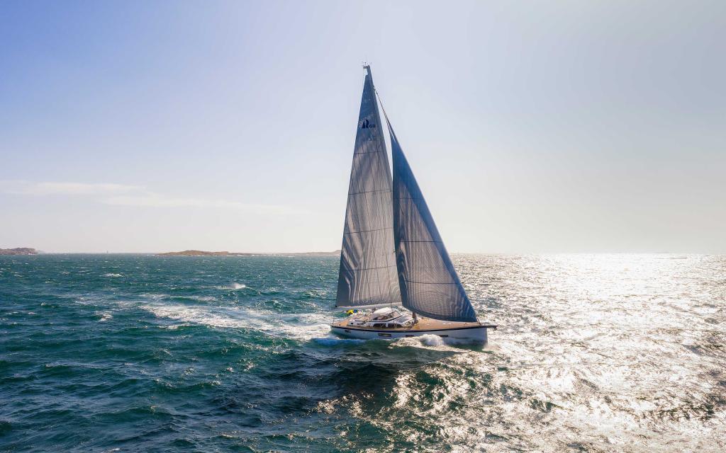 hallberg-rassy-69-sailing-sunlight-open-sea.jpg